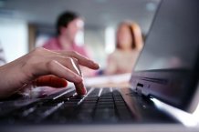 Close up of hand on laptop computer