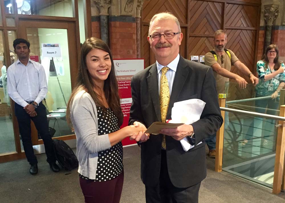 Hannah Little receiving an award in the Graduate School