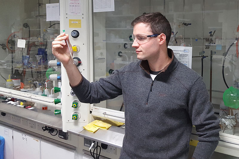 Lecturer Dr Stephen Cochrane analysing a sample in a chemistry lab