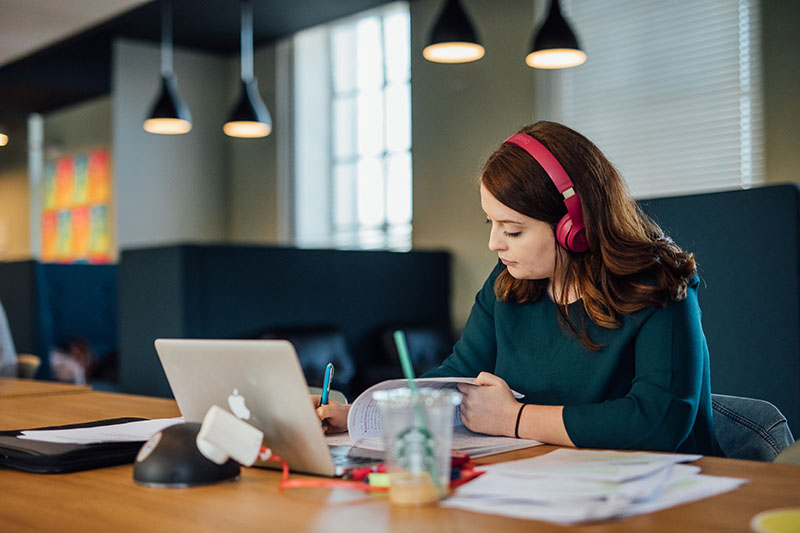 student with headphones elmwood SU