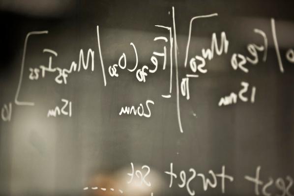 Physics equations on a blackboard