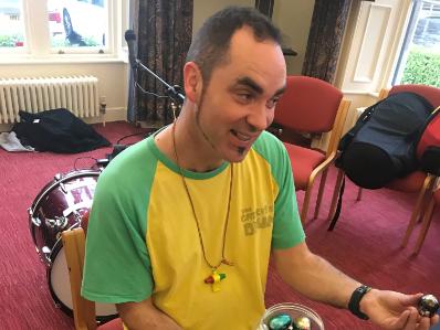 Joe Loughlin of 'The Gathering Drum' facilitating a fun and energetic Drum Circle