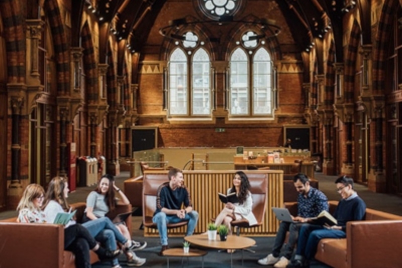 Postgraduate students talking to each other in Graduate School