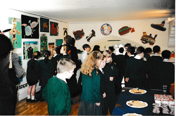 A group of local primary school children admiring their artwork.