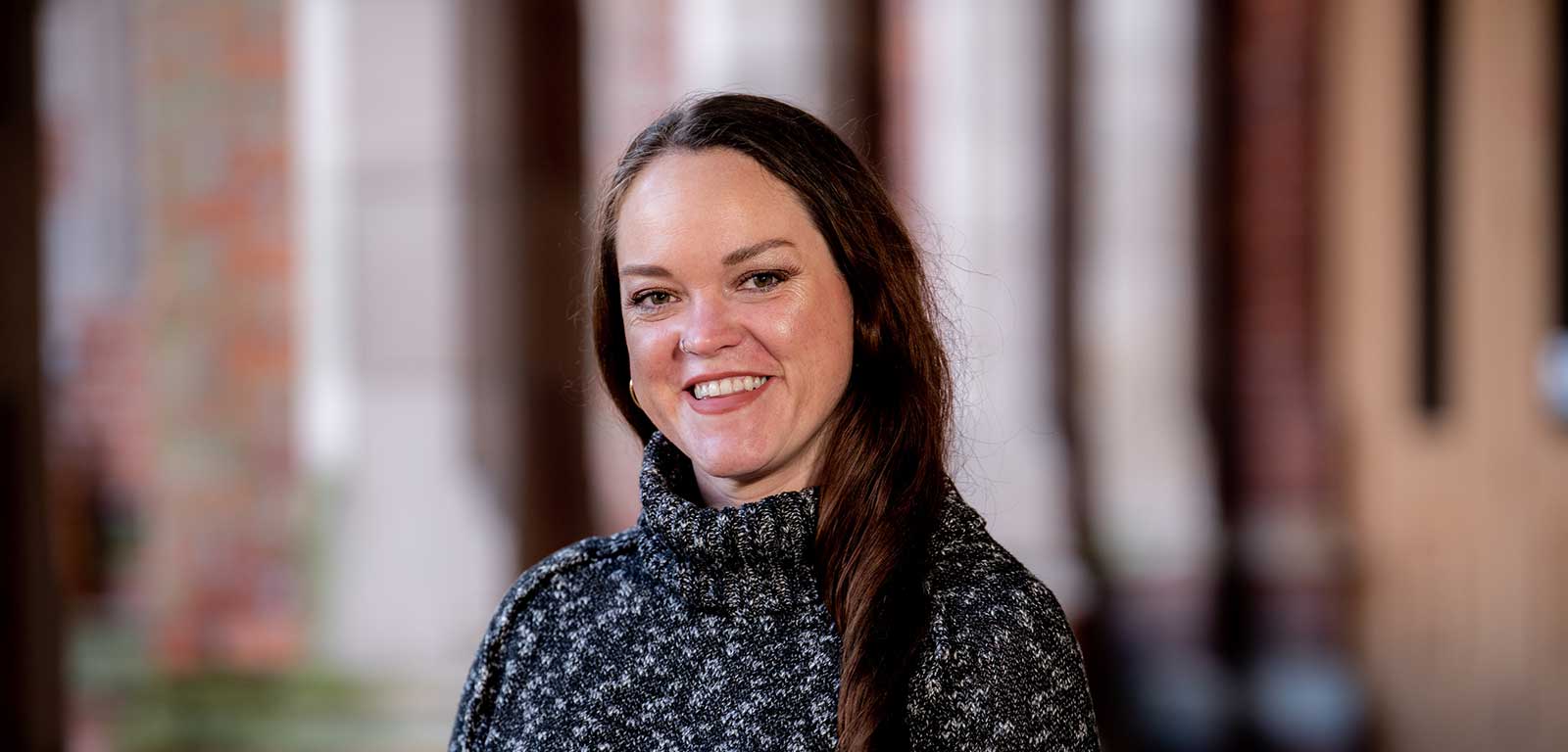 smiling woman with long dark hair