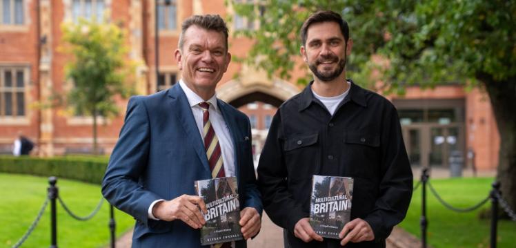 Professor Richard Miles and Dr Kieran Connell in the quadrangle holding Dr Connell's Wolfson Prize shortlisted book