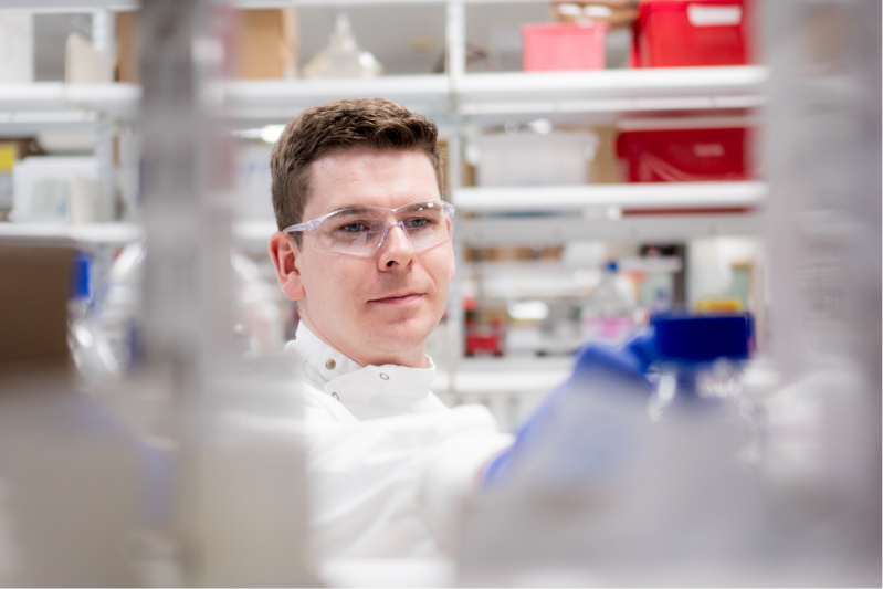 A Queen's student working in a labratory setting