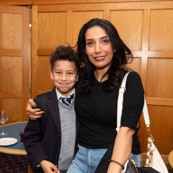 A woman and a boy standing