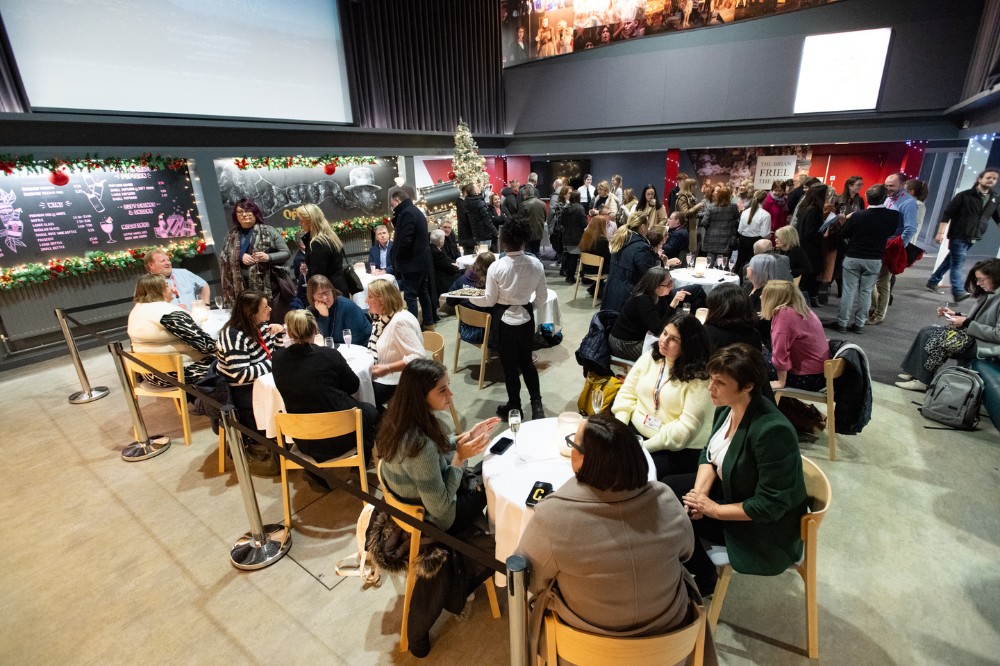 staff and students at a reception in the QFT foyer ahead of the screening of 'Delivering the Impossible: Agreement Twenty Five' documentary, 5 December 2023.