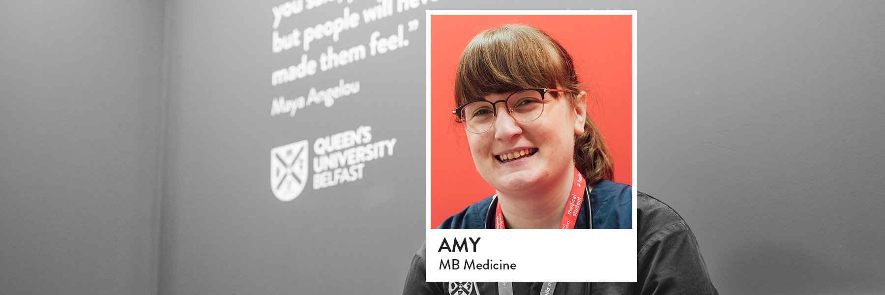 Image of student sitting in InterSim Centre on sofa with red quote wall background