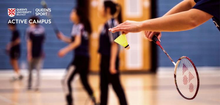 people playing badminton in a gym