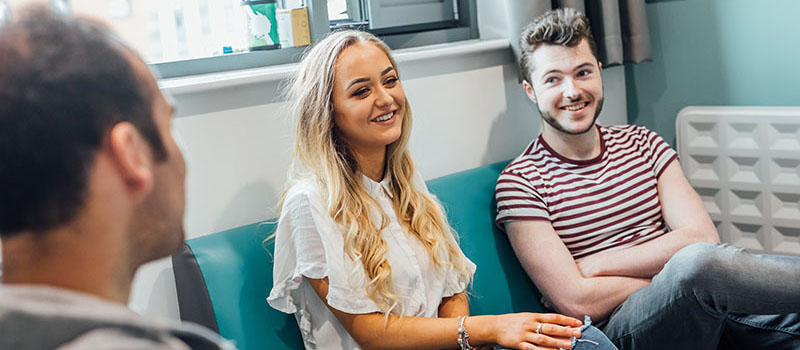 3 students smiling