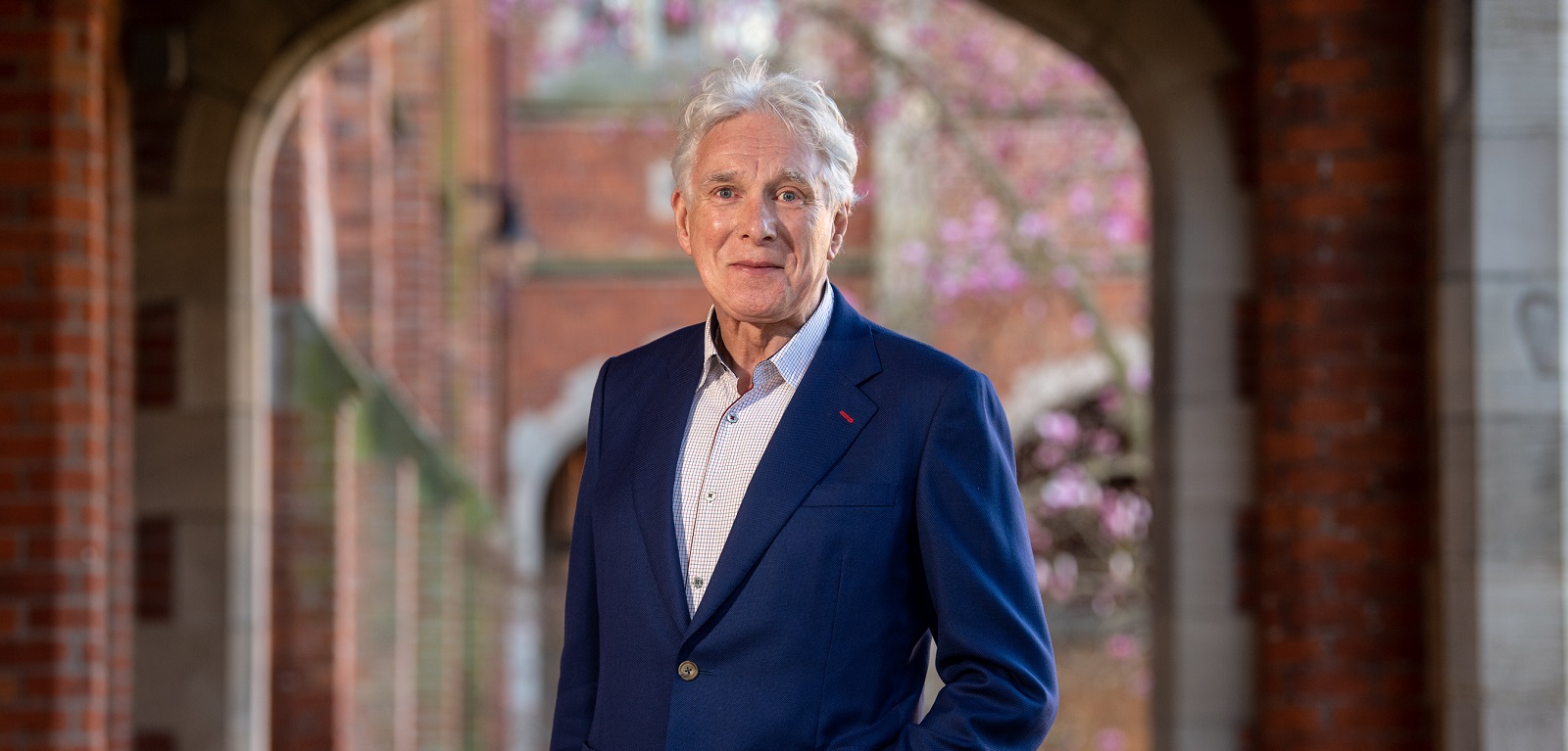 Professor David Thompson under the clock tower in Queen's quadrangle, March 2023