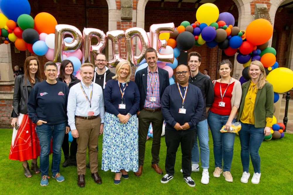 group shot of staff celebrating QUB Pride Picnic 2023 in Queen's quadrangle