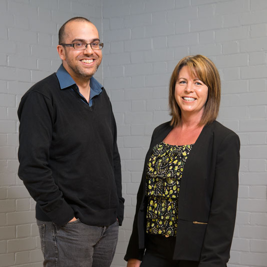 Informal photograph of two members of the School's support staff