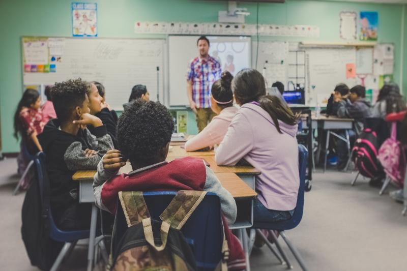 Teacher with a classroom full of young students