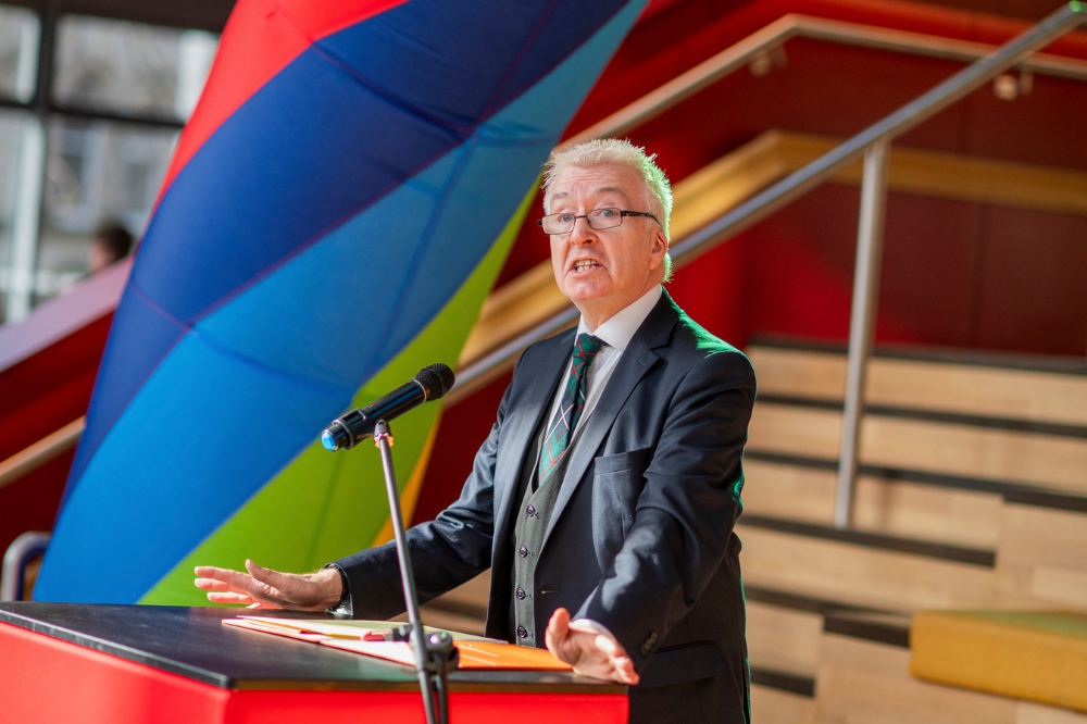 Professor Peter Robertson, Pro-Vice-Chancellor for Equality, Diversity and Inclusion, speaking at the LGBTQueen's Celebration Showcase, One Elmwood